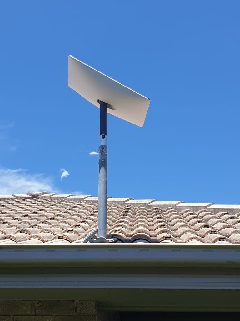 Starlink dish mounted on a tiled Melbourne rooftop