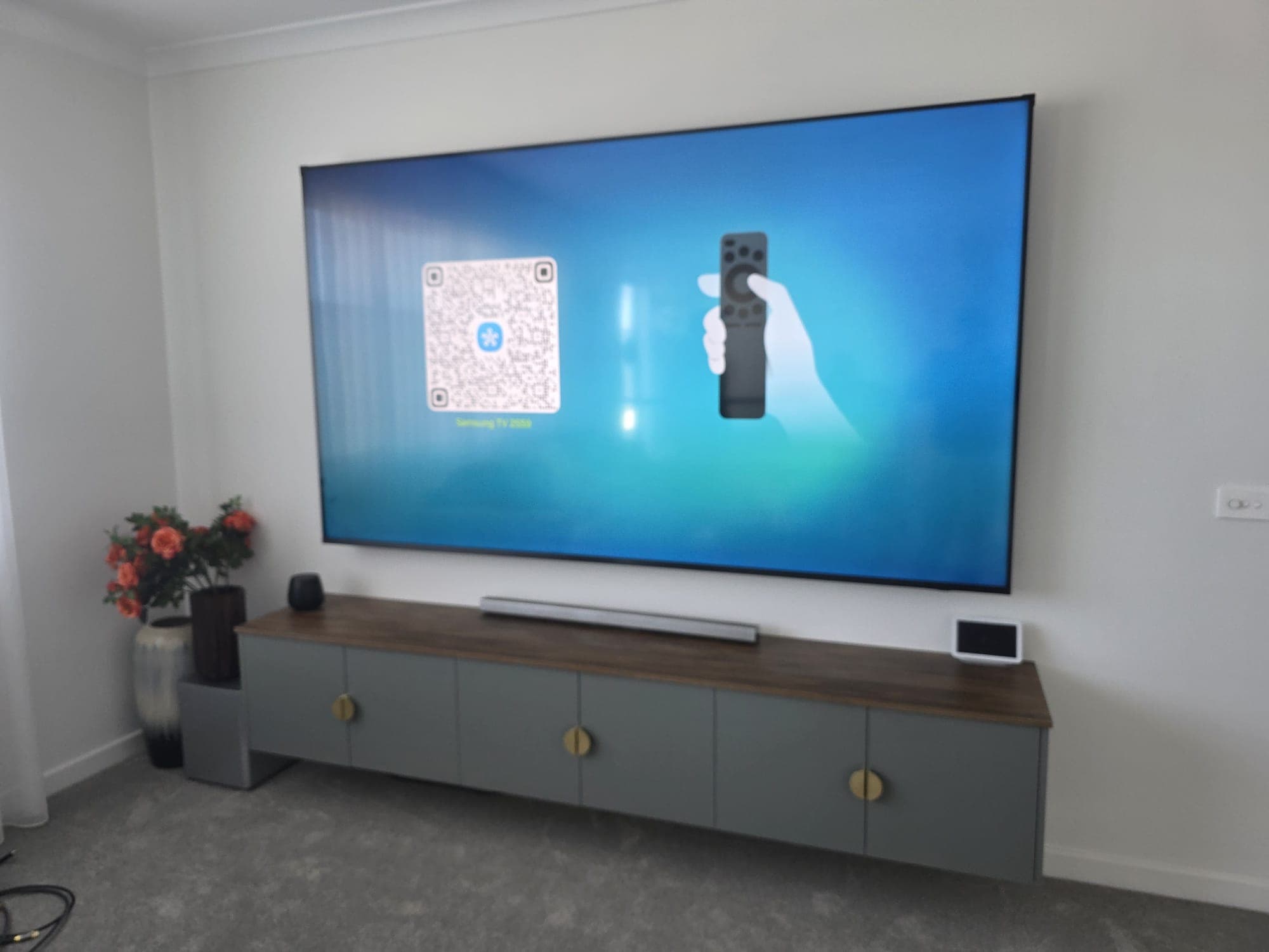Samsung TV with floating console and soundbar