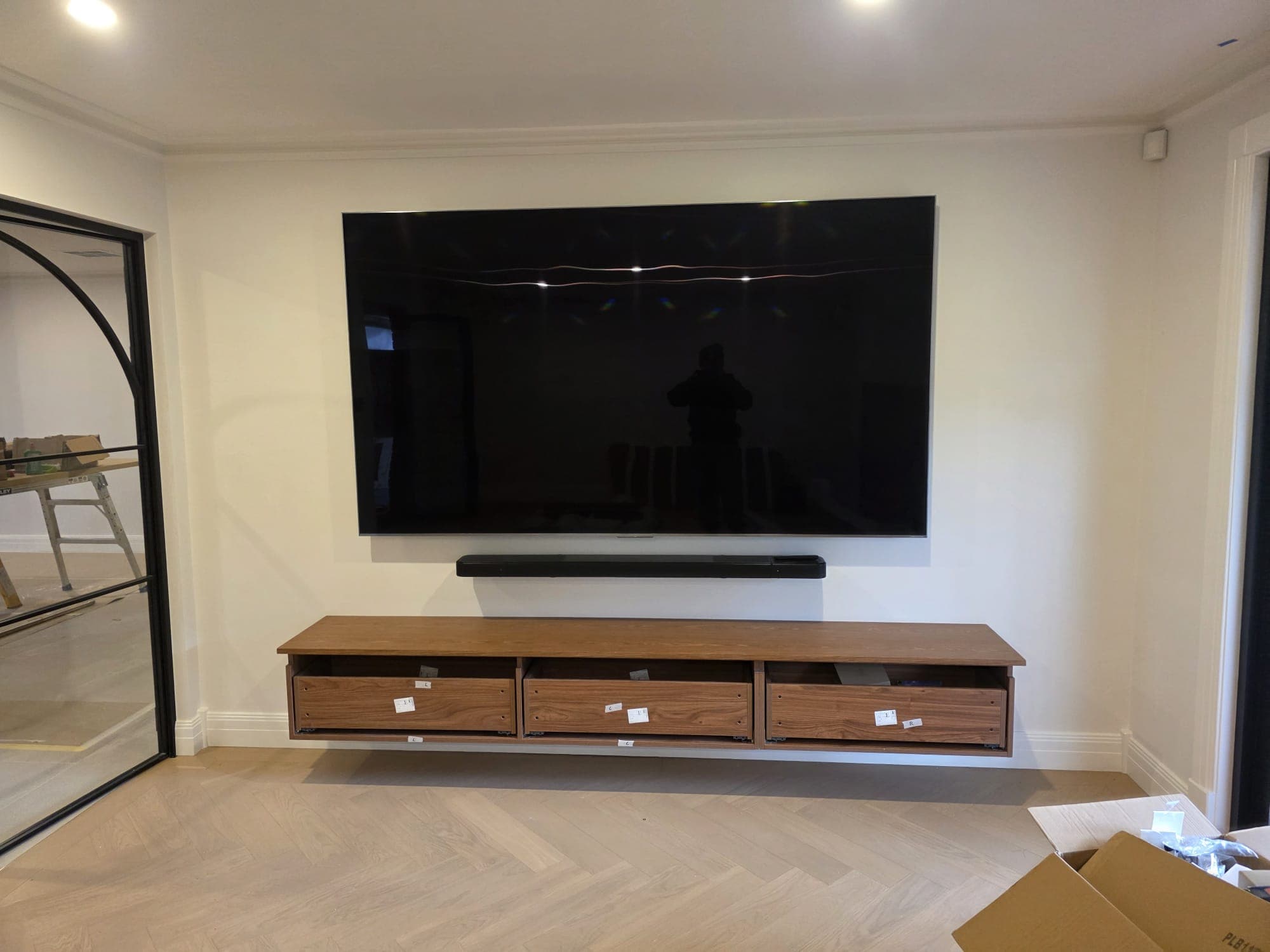 Wall-mounted TV in a Melbourne living space