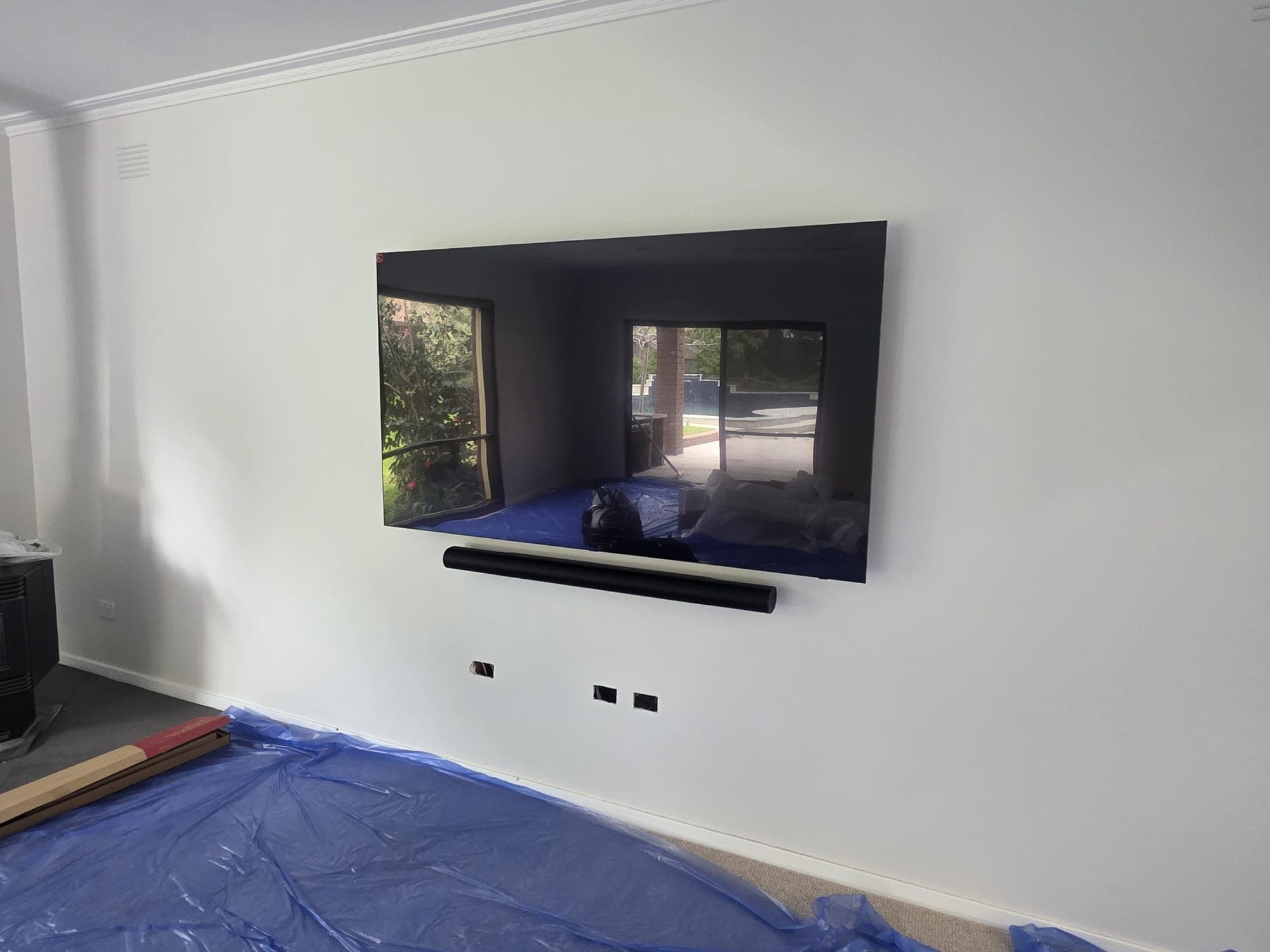 TV installation showing aligned screen and cabling