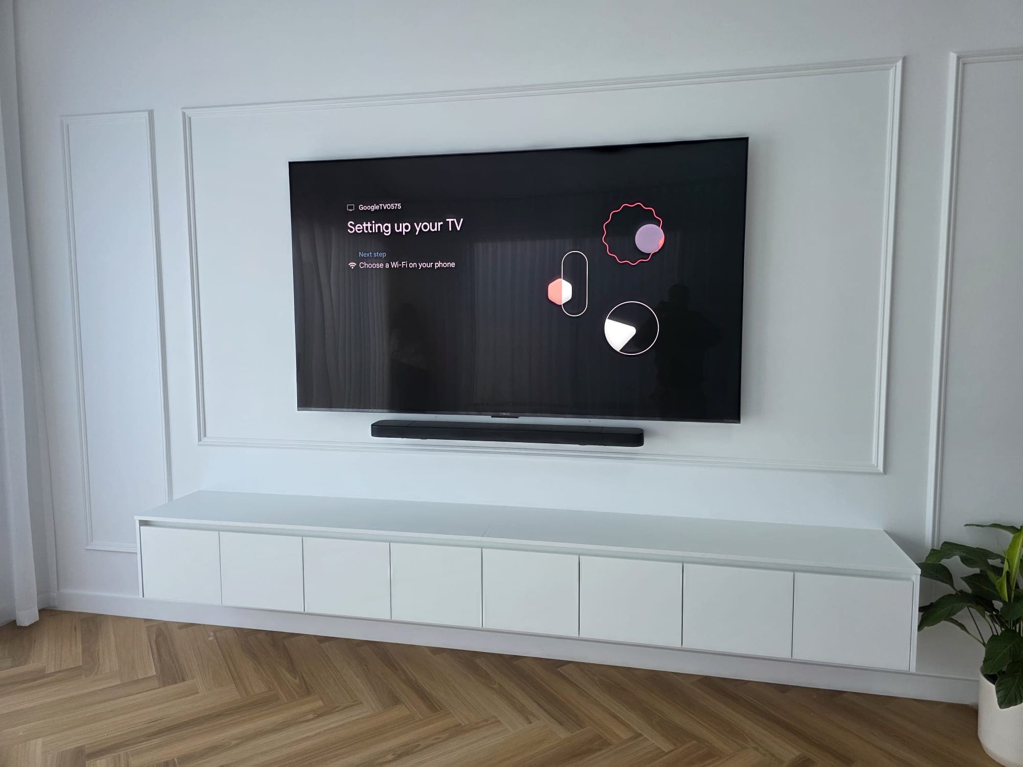 Google TV on a wainscoted wall with soundbar