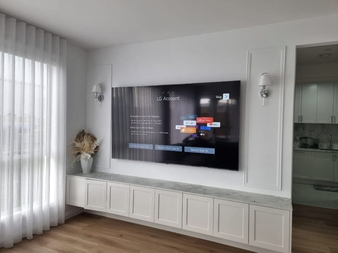 LG account setup screen above marble floating console