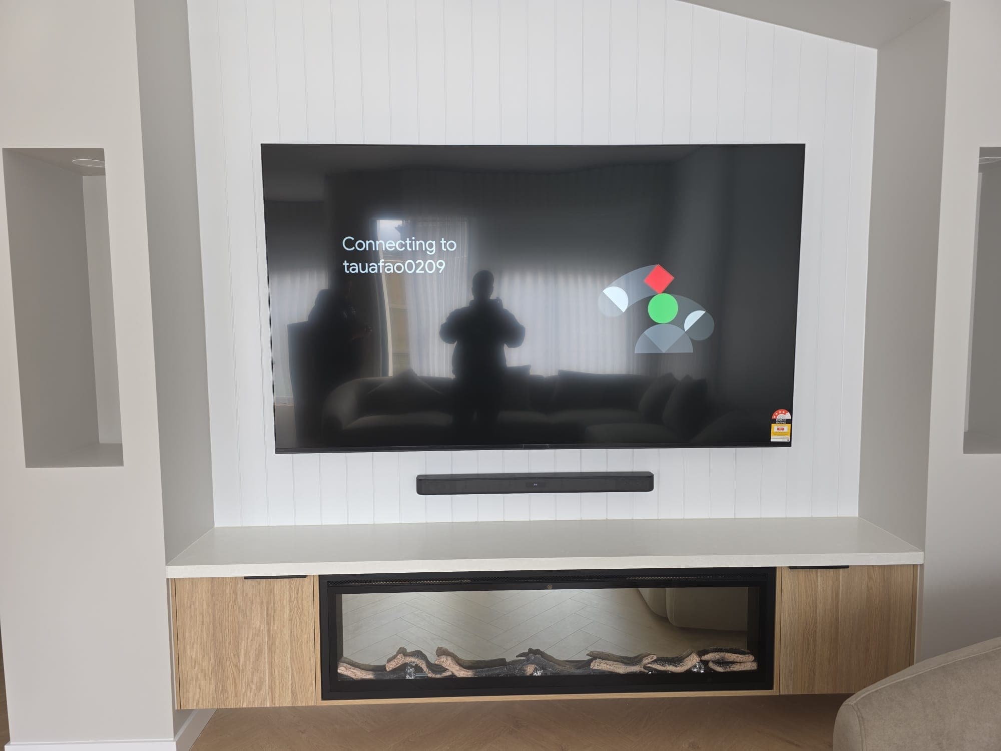 TV and soundbar on a shiplap fireplace wall